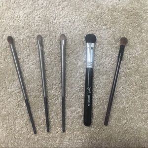 Assorted makeup brushes and Sigma Case